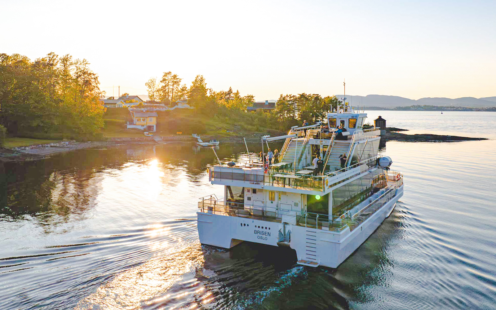 Silent fjord cruise from Oslo with guide, showcasing serene waters and scenic landscapes.