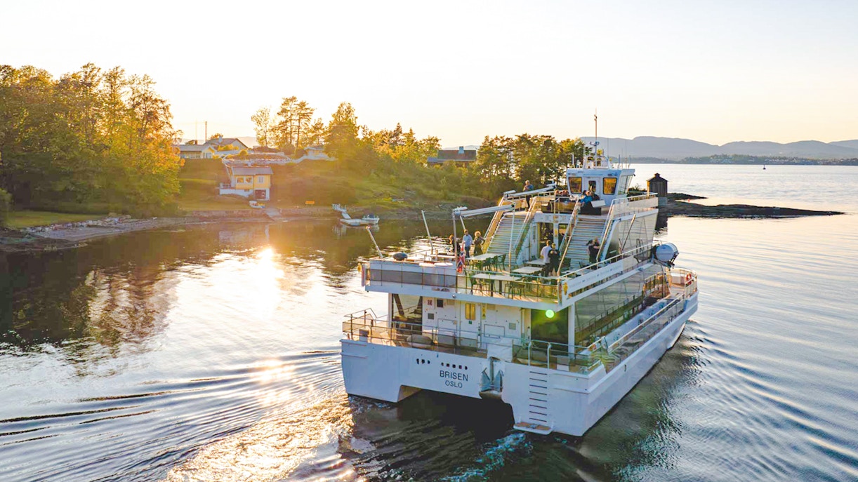 Silent fjord cruise from Oslo with guide, showcasing serene waters and scenic landscapes.