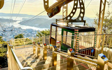 Mt. Senkoji Ropeway cable car overlooking Onomichi cityscape, Hiroshima Prefecture, Japan.