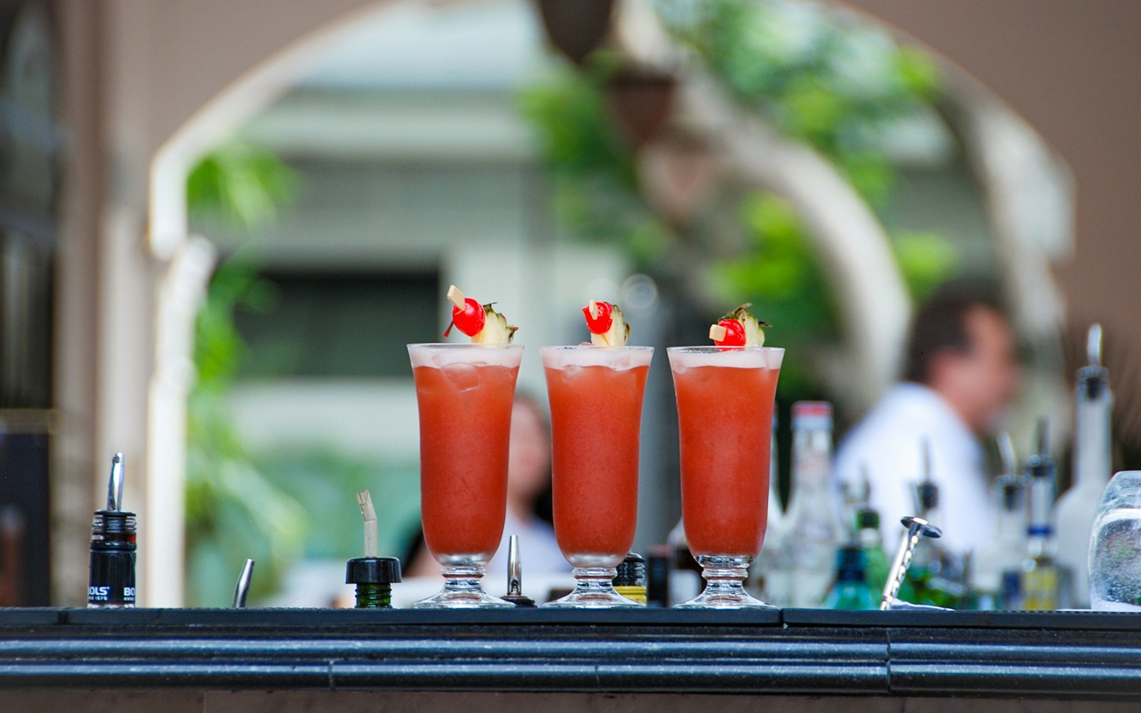 Three cocktails served at swimming pool bar