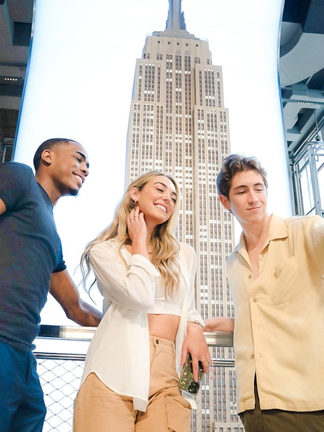 Guests taking a selfie at the Empire State Building observation deck, New York City.