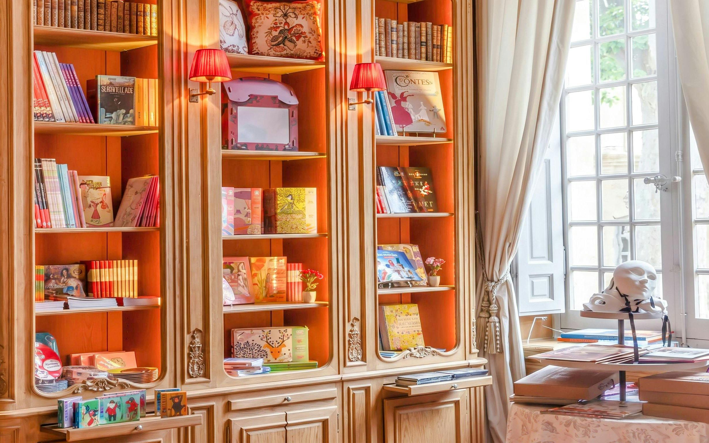 Bookshelves with art books and decor at Caumont Centre d’Art, Aix-en-Provence.