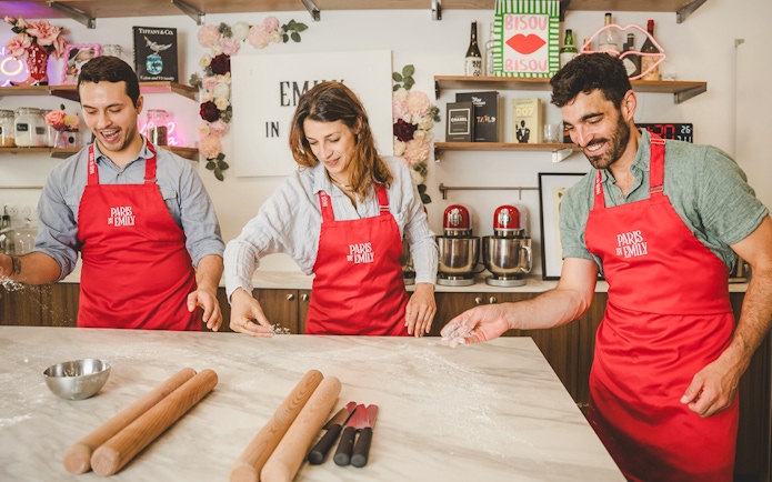 People making croissants at Emily in Paris Croissant-Making Workshop.