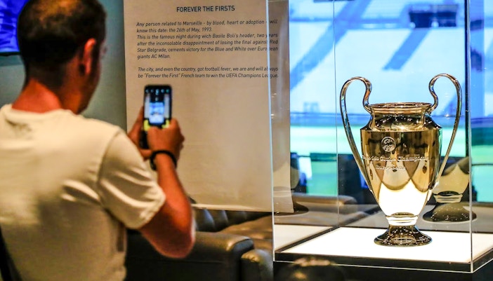 UEFA Champions League trophy on display during Velodrome stadium tour in Marseille.