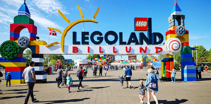 Entrance to LEGOLAND Billund with families entering the park.