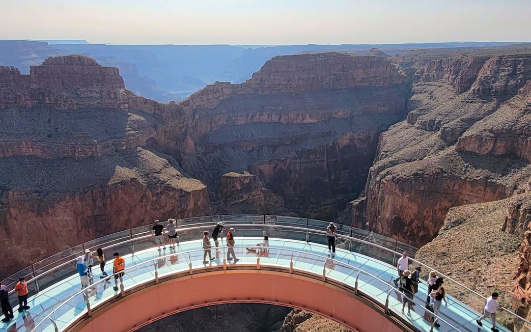 Guests on the Skywalk overlooking the Grand Canyon West Rim, Arizona, USA.