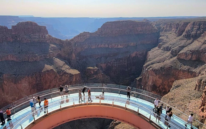 Guests on the Skywalk overlooking the Grand Canyon West Rim, Arizona, USA.