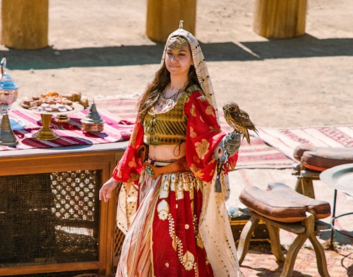 Performer in historical costume at Puy du Fou España Park, Spain, engaging in a live reenactment.