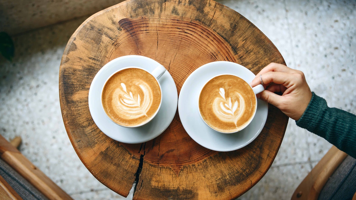 Barista preparing coffee at a café in Rome, Italy.