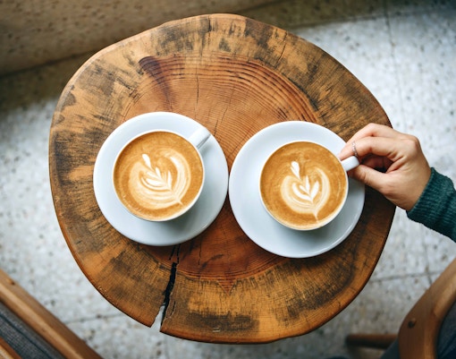 Barista preparing coffee at a café in Rome, Italy.