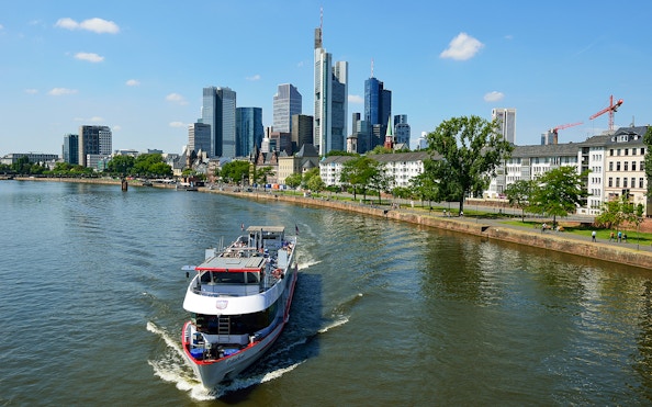 Panorama Cruise boat on the Main River with Frankfurt skyline in the background.