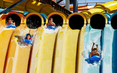 Visitors enjoying water slides at Hurricane Harbor Chicago.