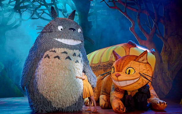 Stage performance of My Neighbour Totoro with Totoro and Catbus characters in West End.