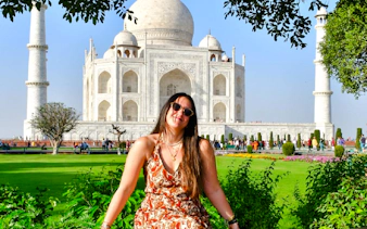 Visitor enjoying the view of the Taj Mahal in Agra, India.