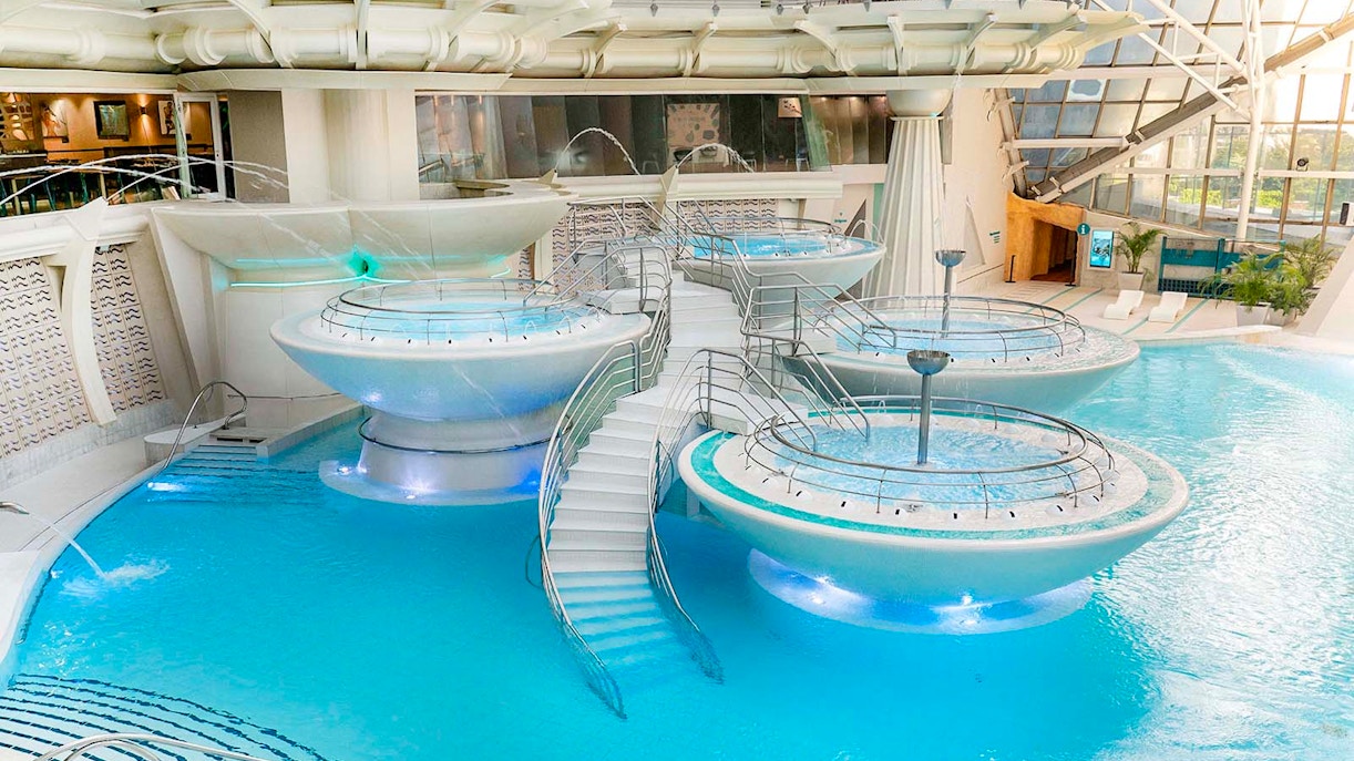 Caldea spa exterior with mountain backdrop in Andorra, highlighting Caldea Classic Entry Tickets.