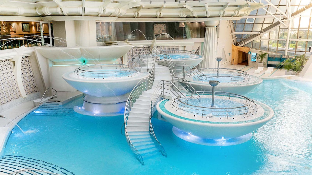 Caldea spa exterior with mountain backdrop in Andorra, highlighting Caldea Classic Entry Tickets.