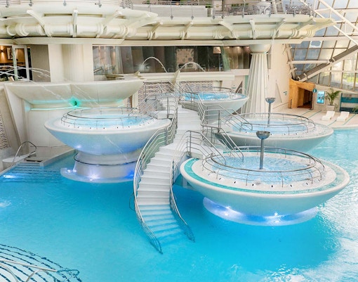 Caldea spa exterior with mountain backdrop in Andorra, highlighting Caldea Classic Entry Tickets.