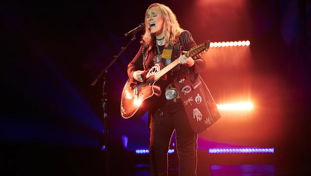 Singer performing on stage with a guitar during "Melissa Etheridge: My Window" show.