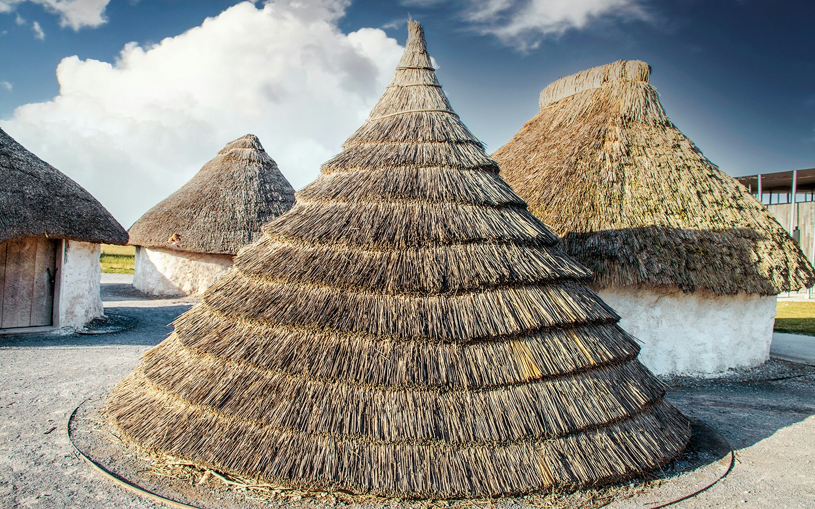 Neolithic straw cone-shaped houses near Stonehenge, England.