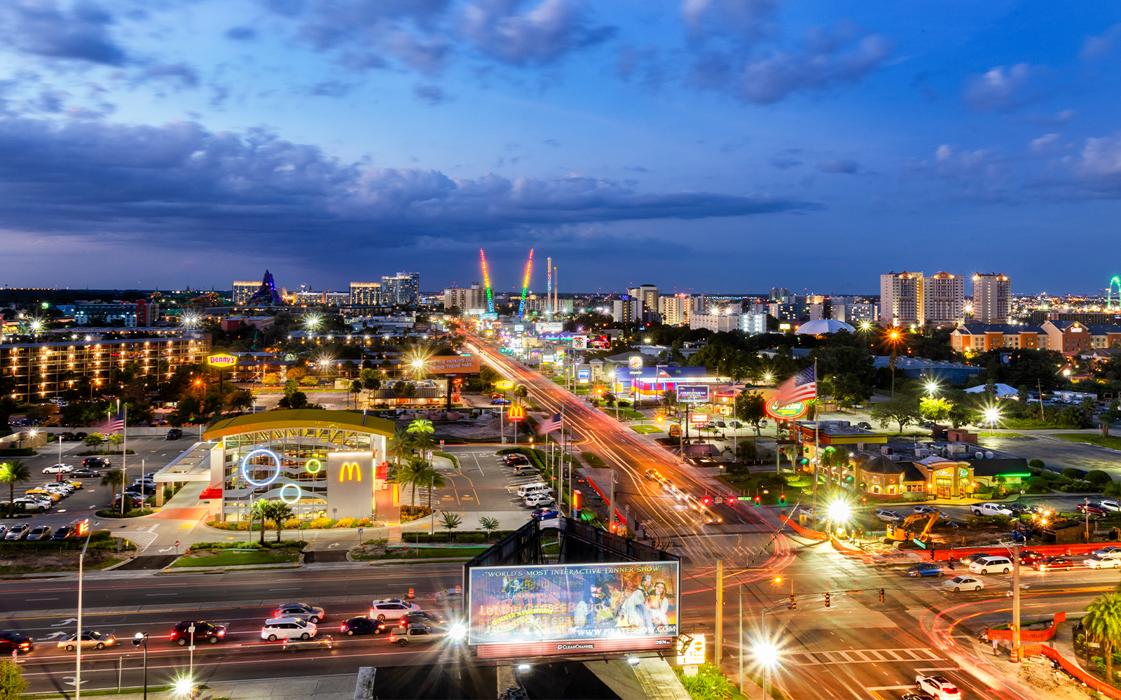 Orlando cityscape at night with illuminated streets and skyline.