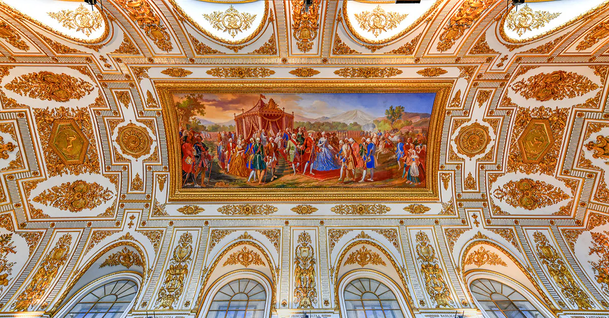 Ceiling fresco and ornate decorations at the Royal Palace of Caserta, Italy.