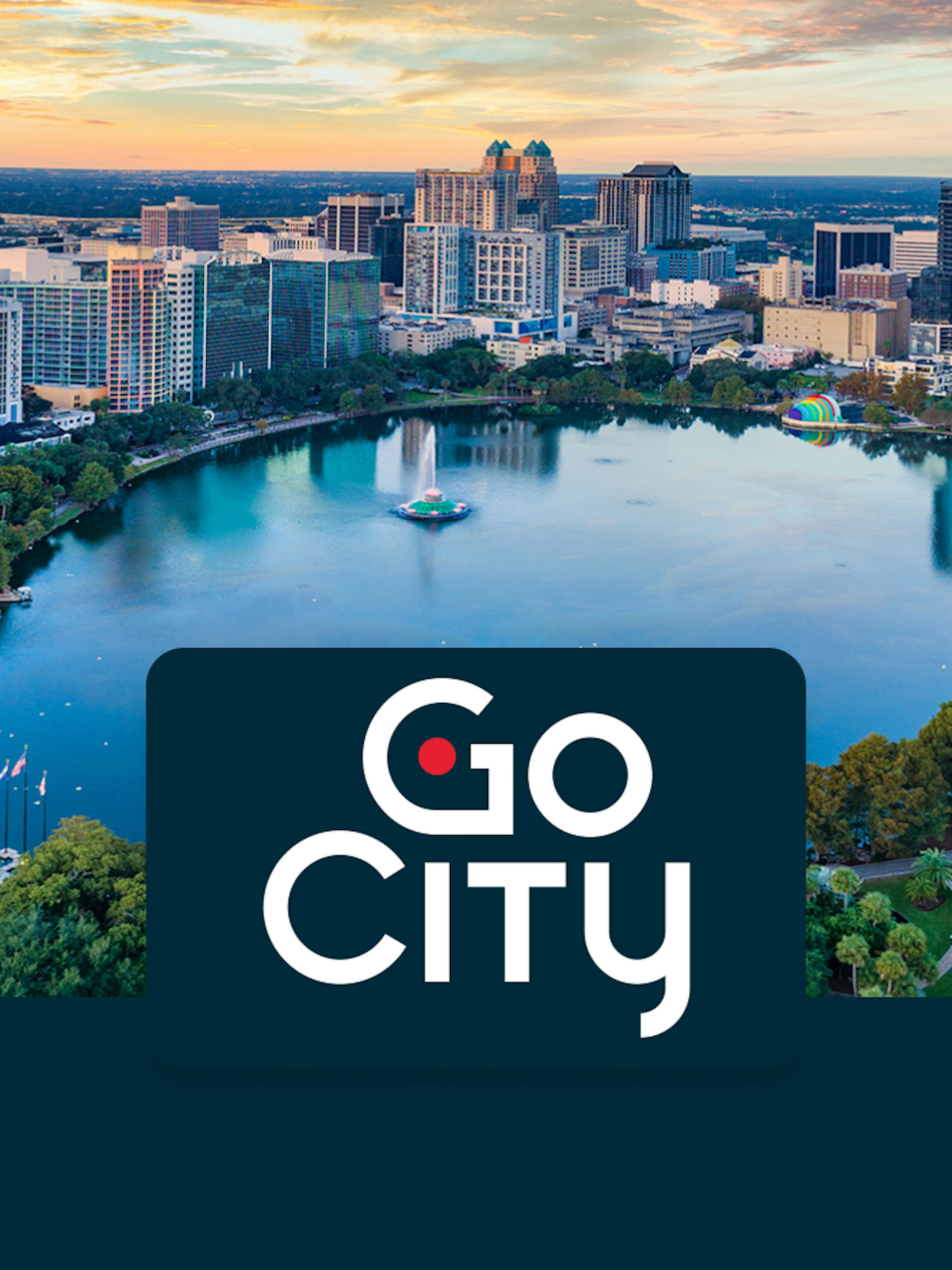 Aerial view of downtown Orlando skyline and Lake Eola at sunset.