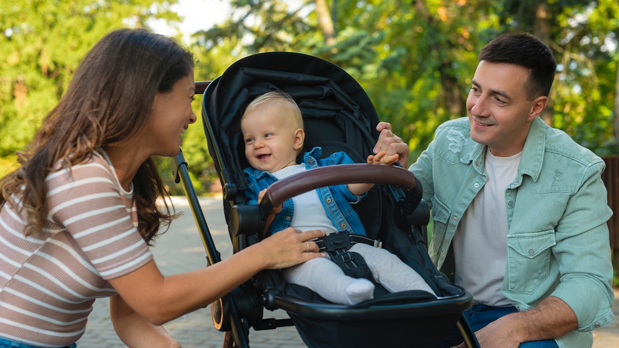 Family enjoying time at Boboli Garden with a baby in a stroller.