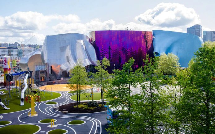 Museum of Pop Culture in Seattle with vibrant architecture and nearby playground.
