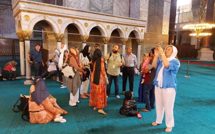 Visitors exploring the interior of Hagia Sophia, Istanbul, with E-pass access.