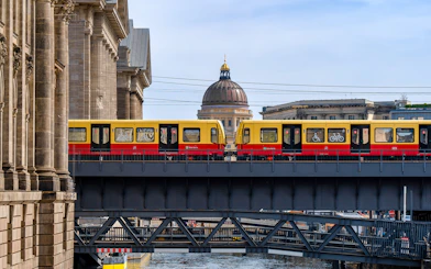 S-Bahn train crossing a bridge on Museum Island, Berlin.