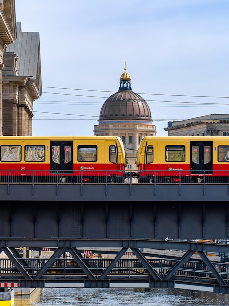 S-Bahn train crossing a bridge on Museum Island, Berlin.