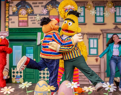 enjoying Easter festivities at Port Aventura theme park, Spain, with colorful decorations and activities.