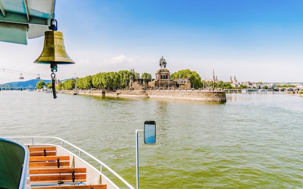 Koblenz sightseeing cruise view of Deutsches Eck monument at river confluence.