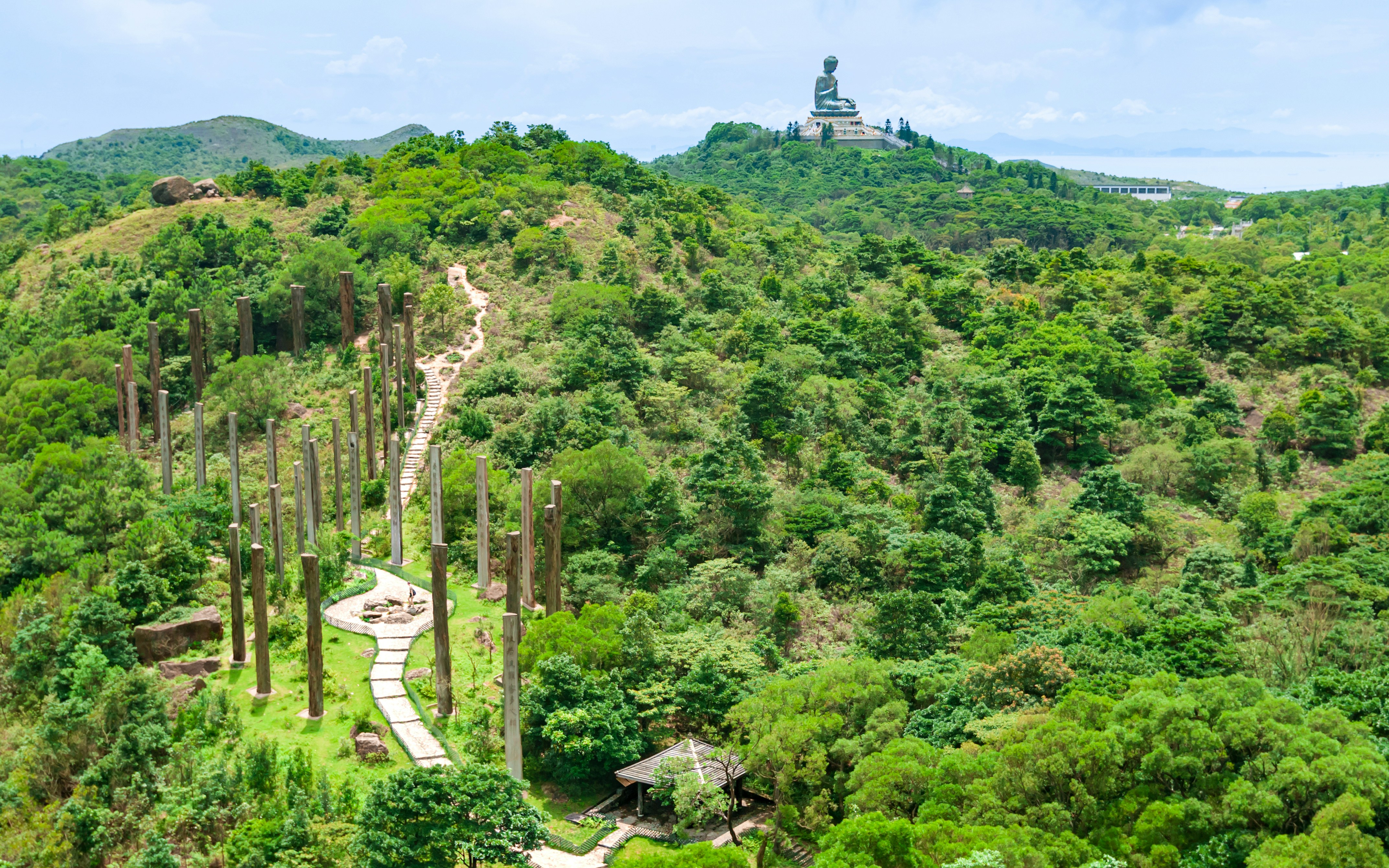 Steles along Wisdom Path with Tian Tan Buddha in the distance, Ngong Ping, Lantau Island.