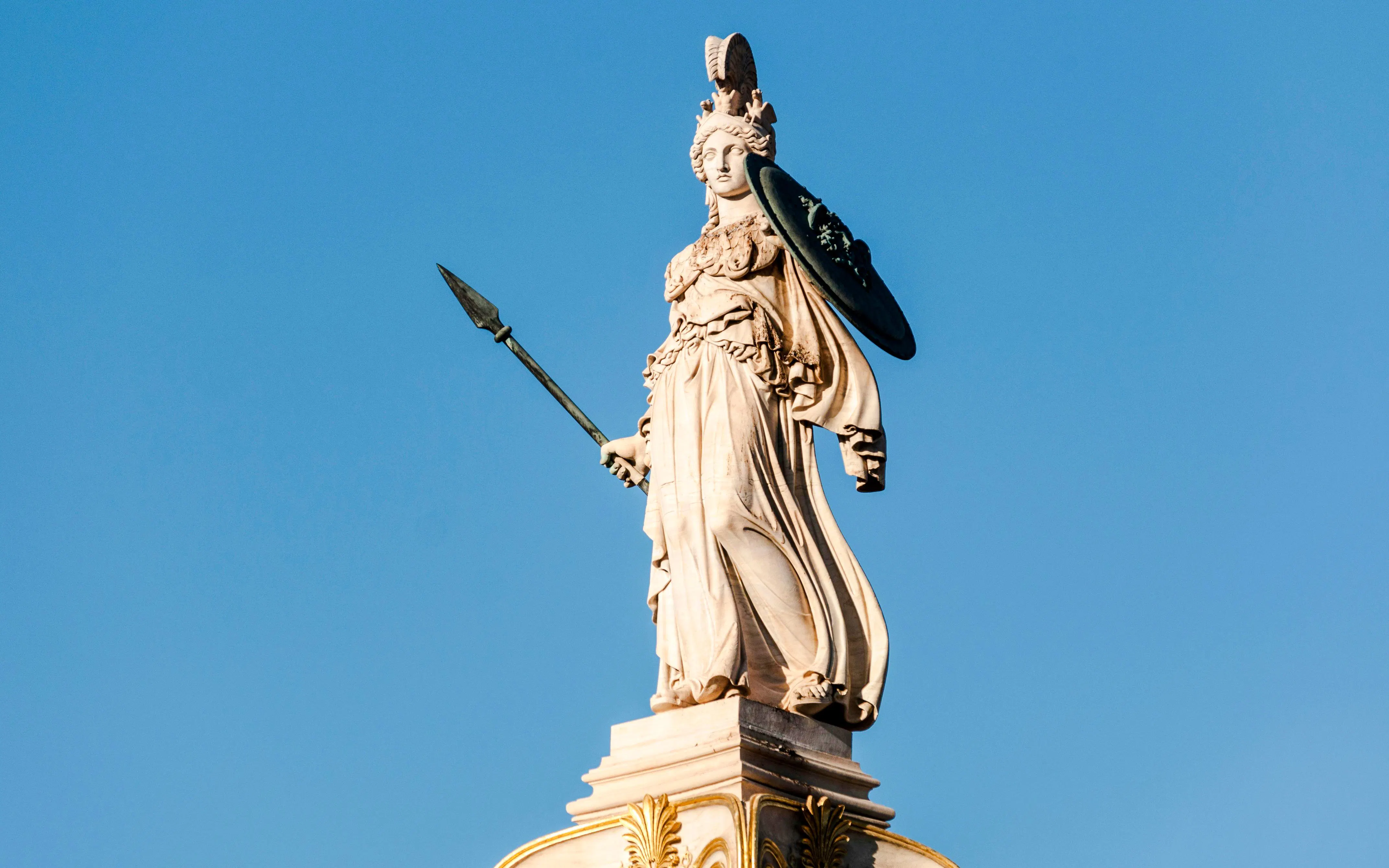 Statue of Athena holding a spear and shield at Athens Acropolis.