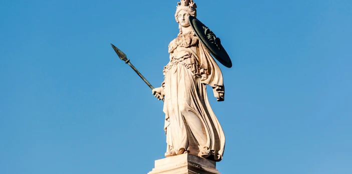 Statue of Athena holding a spear and shield at Athens Acropolis.