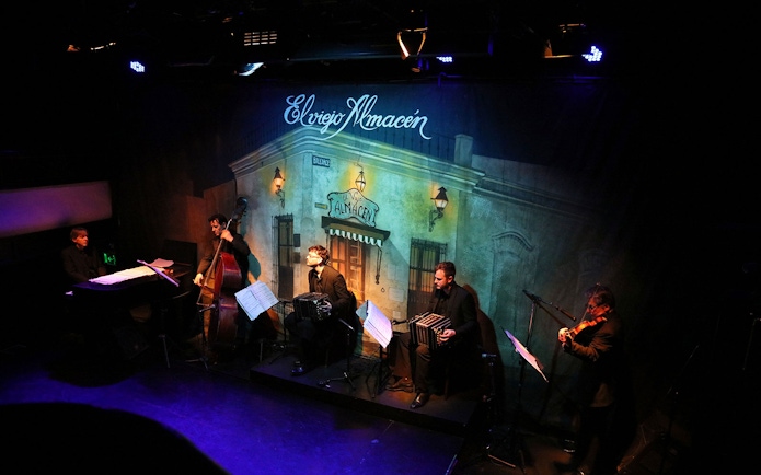 Musicians performing at El Viejo Almacén during a tango show in Buenos Aires.