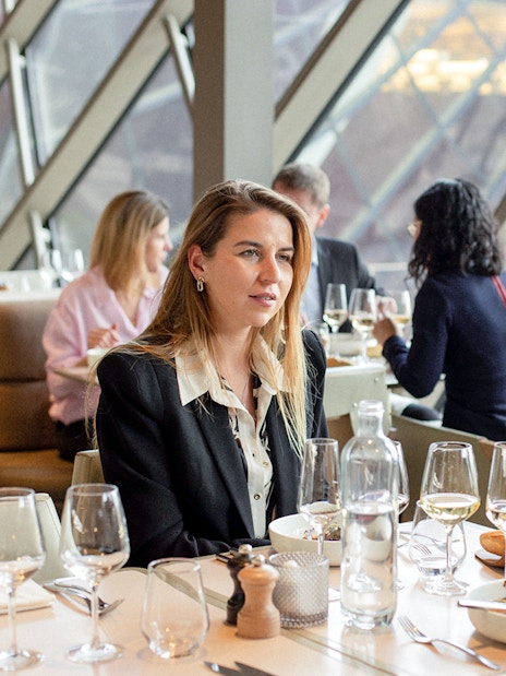 Lunch at Madame Brasserie, Eiffel Tower, with diners enjoying a meal and view.