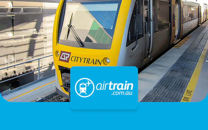 Citytrain at Brisbane station platform for airport transfers.