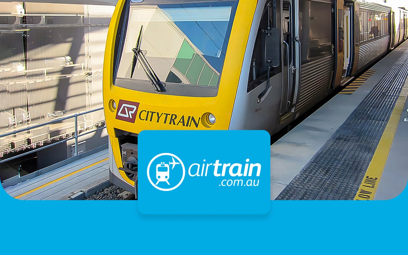 Citytrain at Brisbane station platform for airport transfers.
