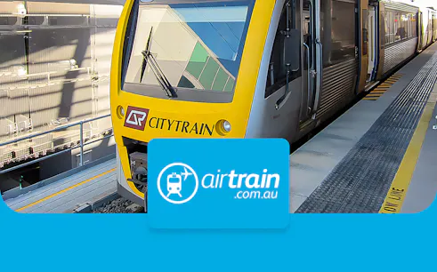 Citytrain at Brisbane station platform for airport transfers.