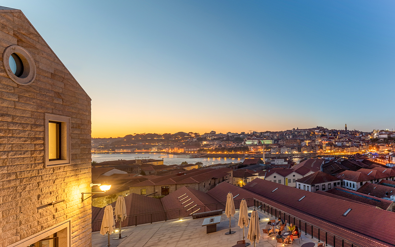 Fonseca Port Wine Cellars terrace overlooking Porto at sunset.