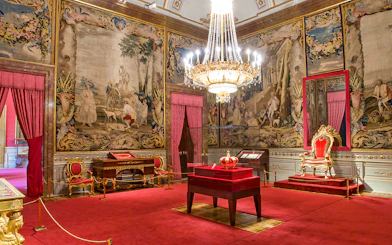 Crown of Charles III displayed inside the Royal Palace of Madrid.