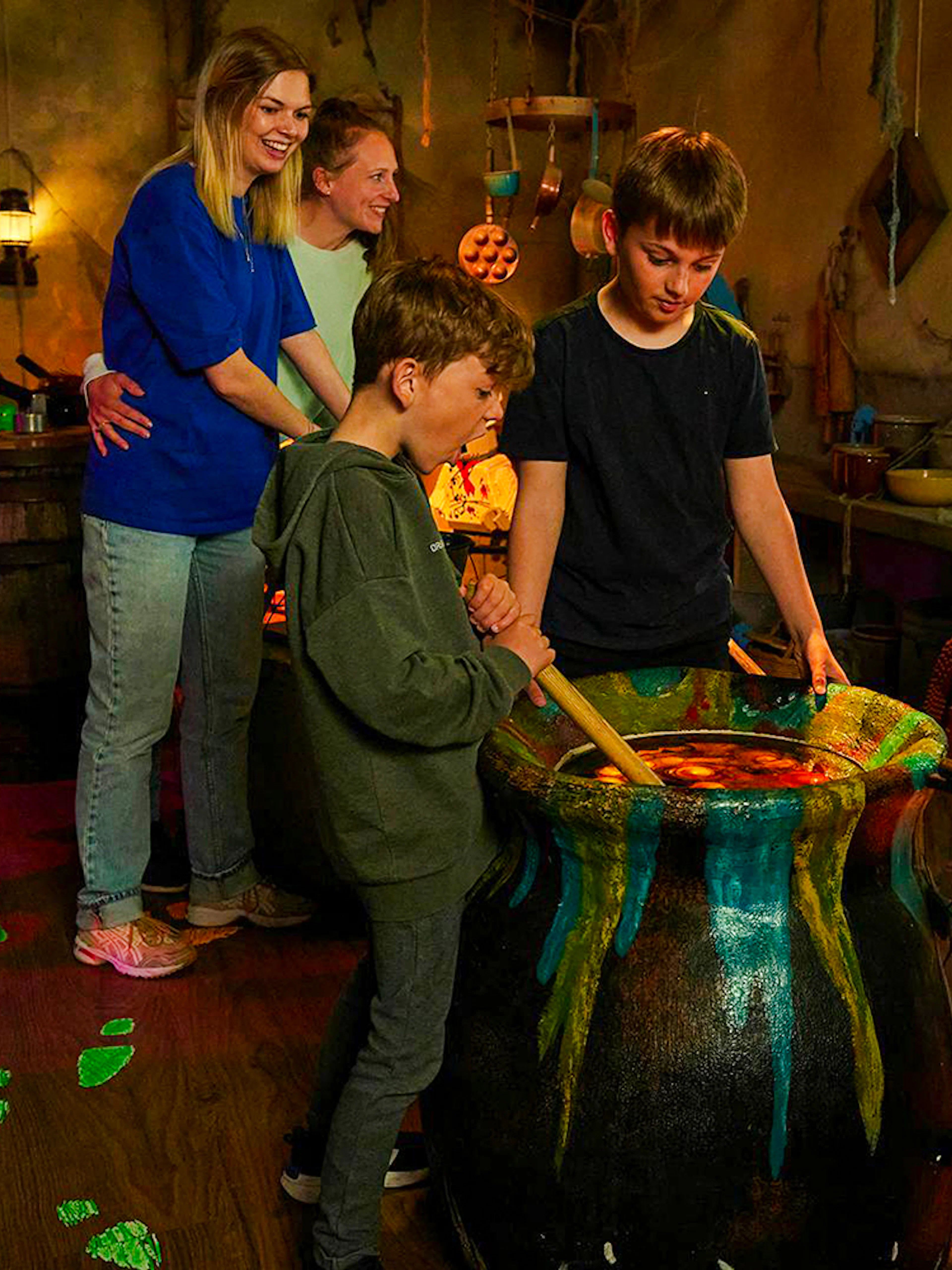 Guests stirring a cauldron during Halloween at Legoland Billund.