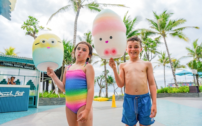 Kids holding cotton candy at Atlas Beach Club.
