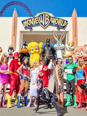 Characters in costume at Warner Bros. Movie World entrance.