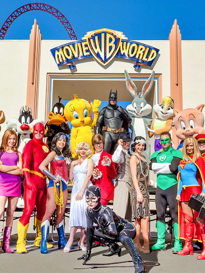 Characters in costume at Warner Bros. Movie World entrance.