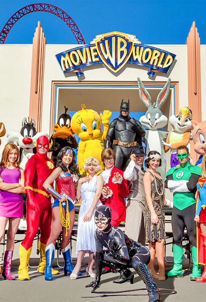 Characters in costume at Warner Bros. Movie World entrance.