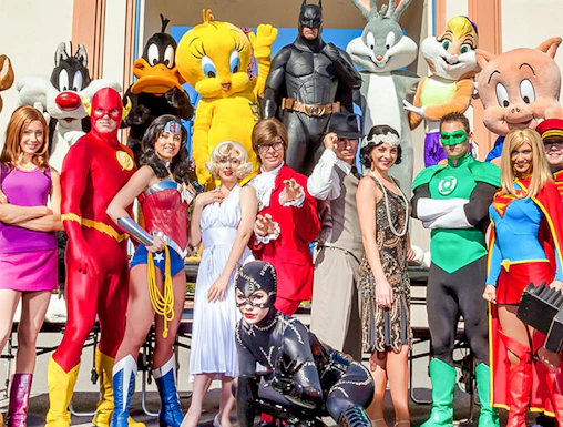 Characters in costume at Warner Bros. Movie World entrance.
