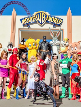 Characters in costume at Warner Bros. Movie World entrance.